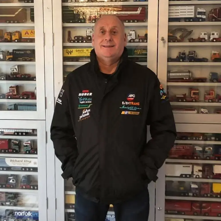 Man standing with embroidered jacket